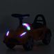 Каталка-толокарь Bambi Racer M 6299-7 оранжевый с корзиной под сиденьем, ручка для переноски, передние фары со светом, музыка